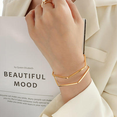 18K gold trendy simple polygonal line hollow double-layer design light luxury style bracelet - Syble's