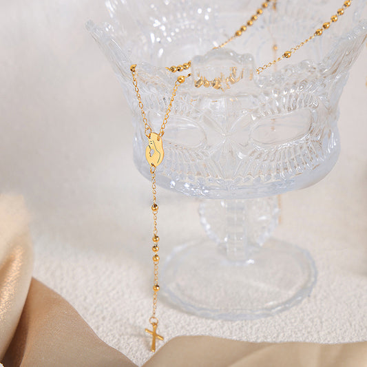 18K gold fashionable woman portrait with cross tassel design versatile necklace - Syble's