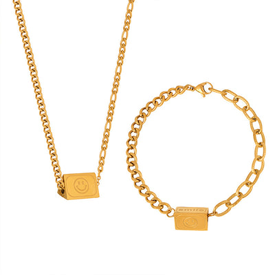 18K gold novel and fashionable tapered bracelet and necklace set with smiley face and "Smile" design - Syble's